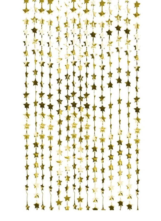 Gulddraperi med blingande stjärnor